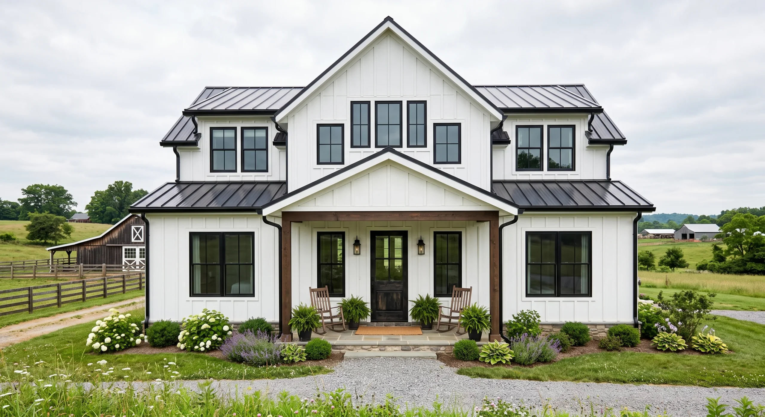 A crisp white Modern Farmhouse exterior with black window frames, a metal standing-seam roof section, board-and-batten siding, and a simple gabled front porch, soft overcast daylight, straight-on shot emphasizing the black-and-white contrast.